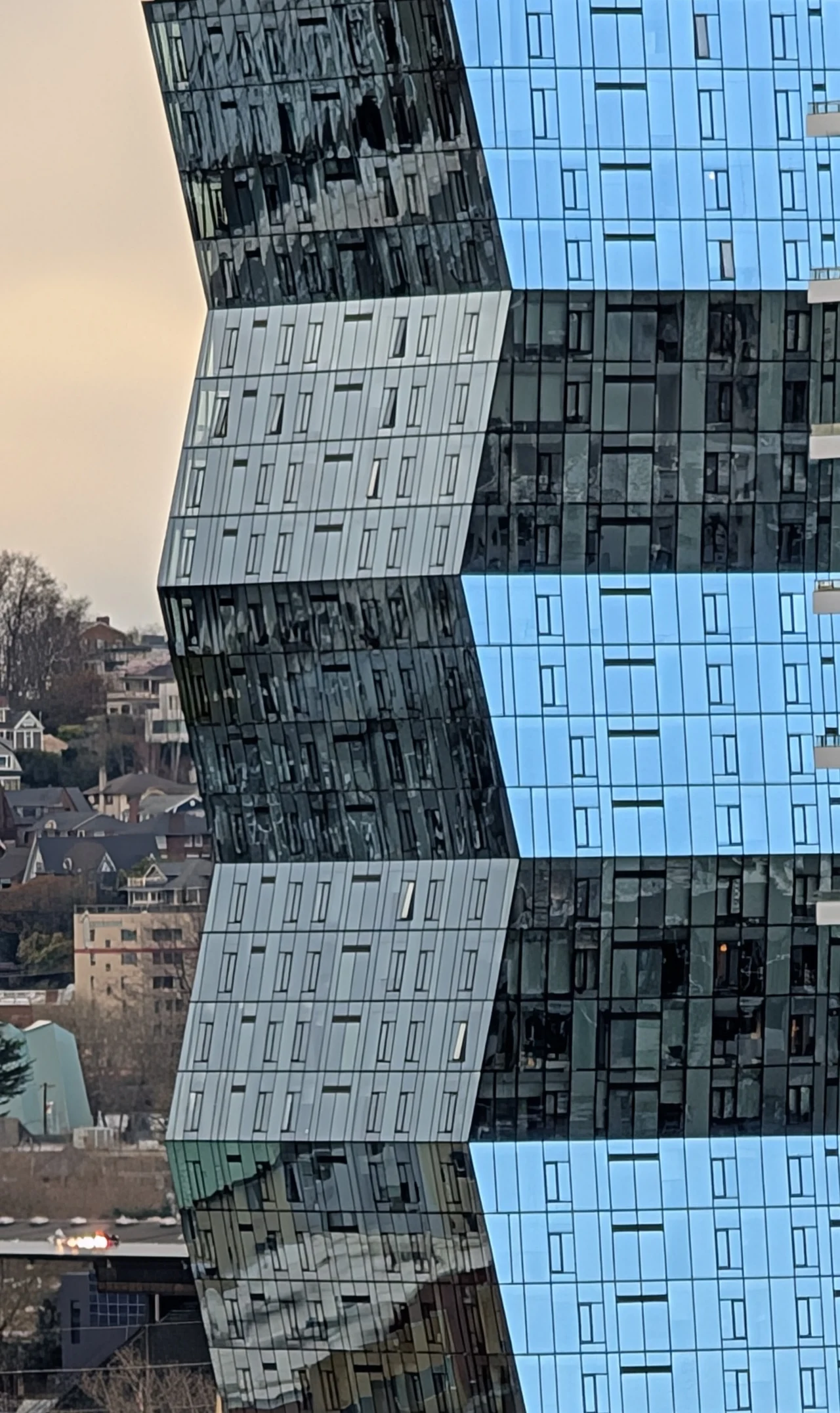 An angular tower folding through blue reflections.
